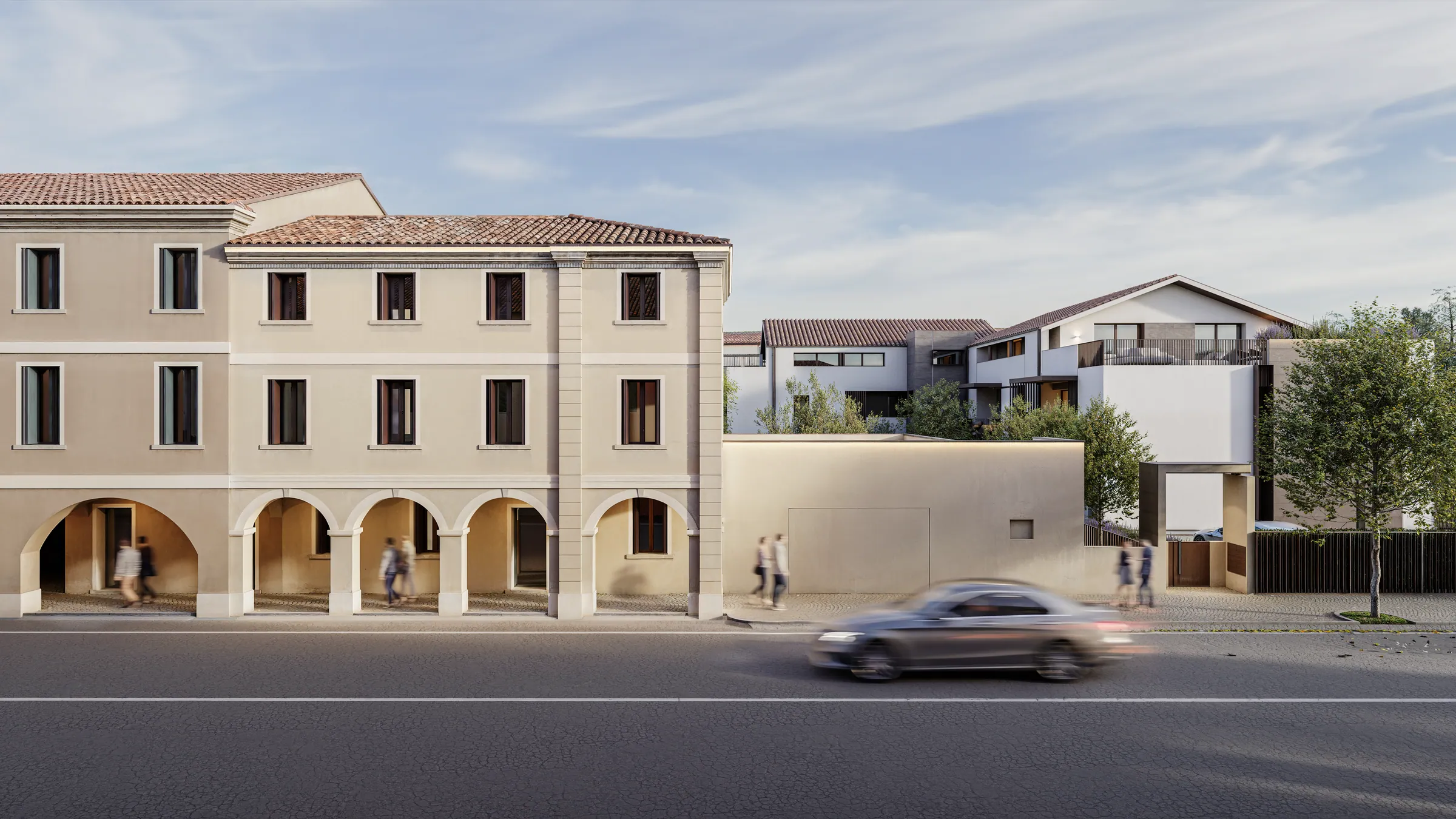 Ingresso di Residence Oltremura tra preesistenze e nuovi volumi residenziali